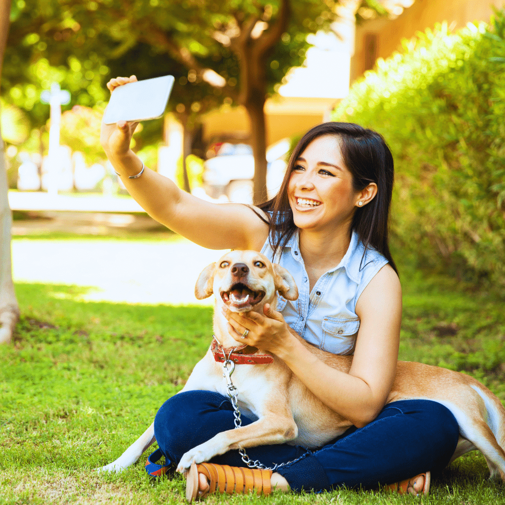 A dog and its owner taking outdoor photos